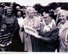 1004A-6 Mrs Darby presenting a cheque on retirement of Ernest Jackson as village postman