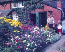 1004A-9 Joe Rowney at No 2 Brook Cottage in its original state.
